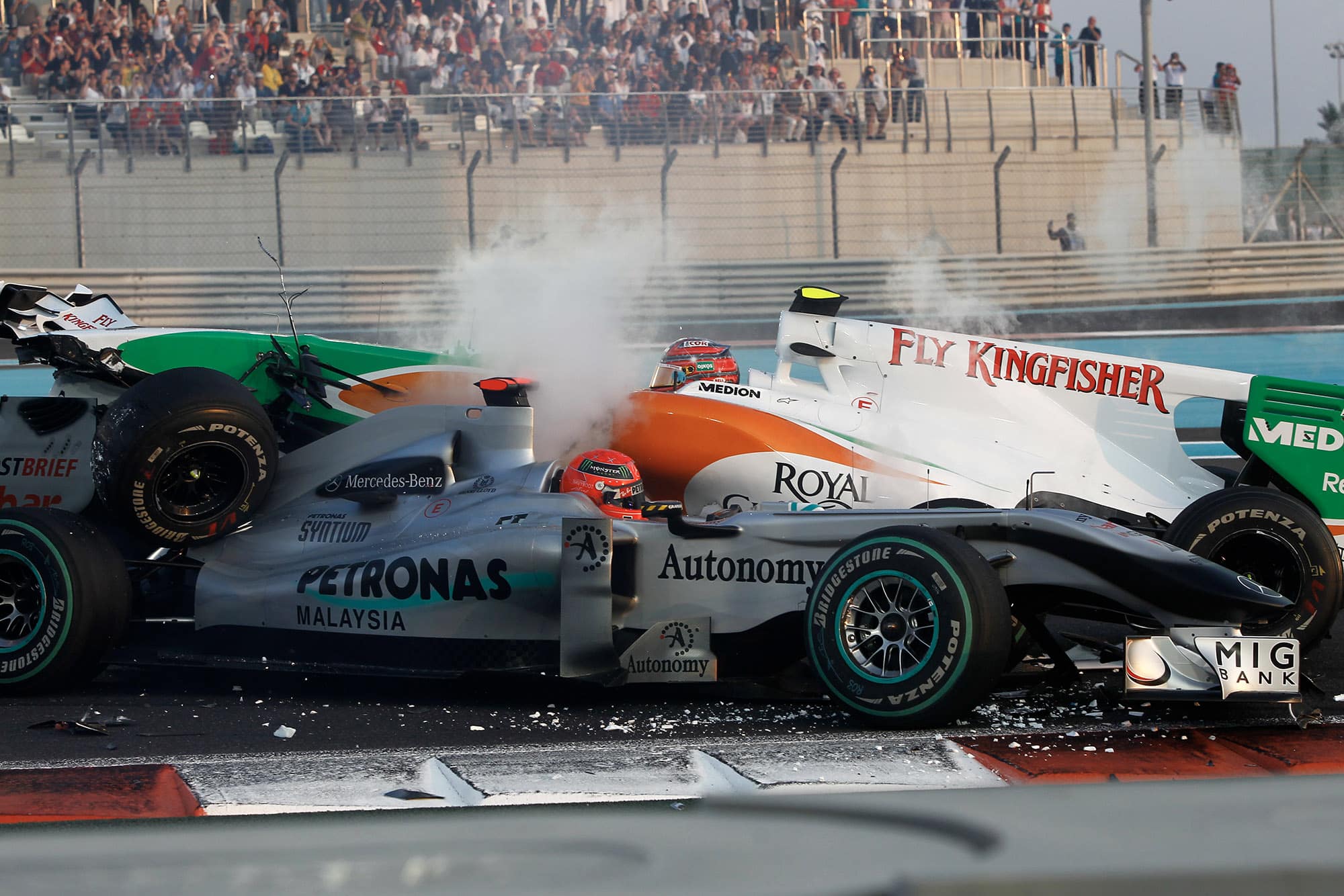 Antonio Luizzi crashes into Michael Schumacher at the start of the 2010 Abu Dhabi Grand Prix