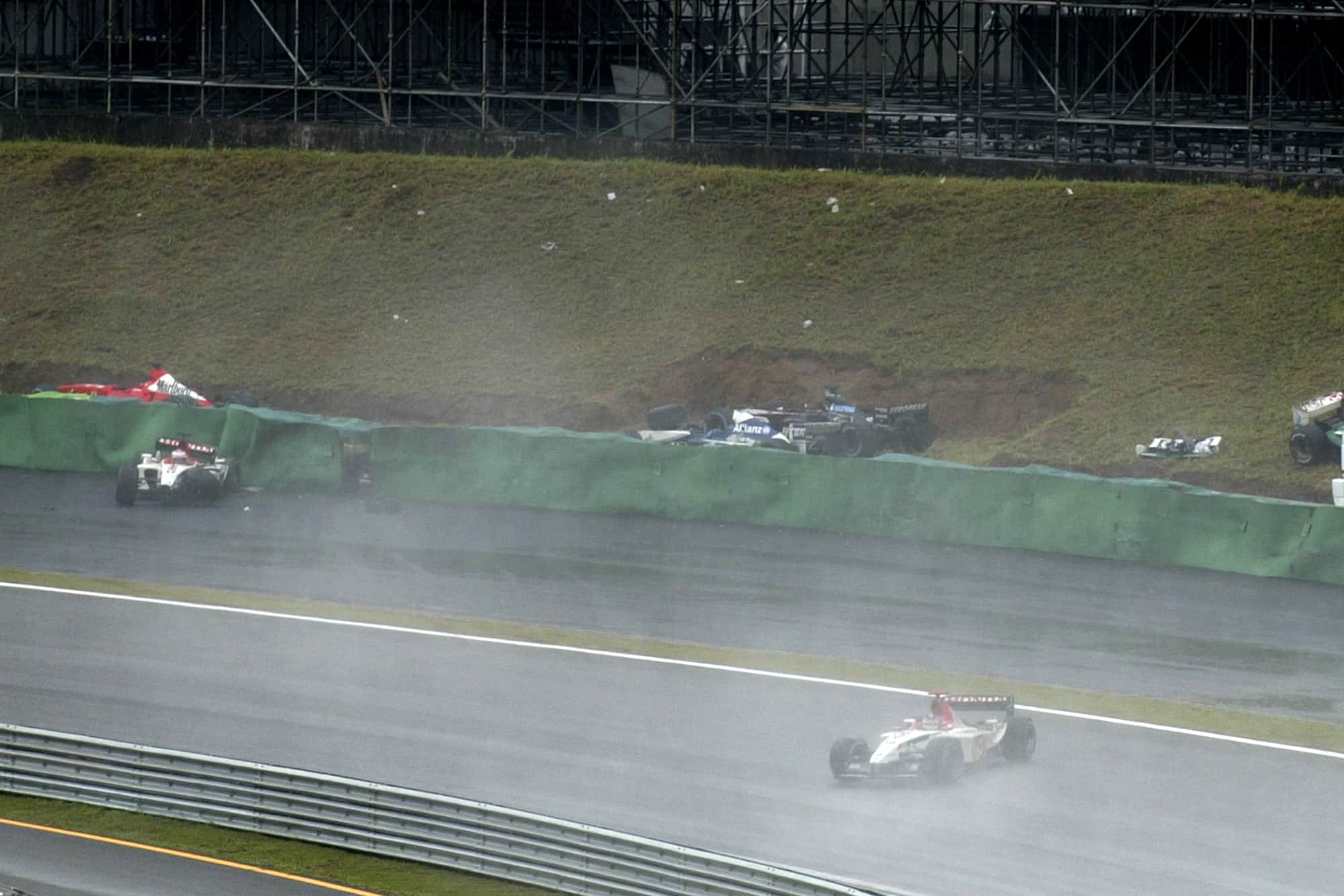 Cars aquaplane off the track during the 2003 Brazilian Grand Prix