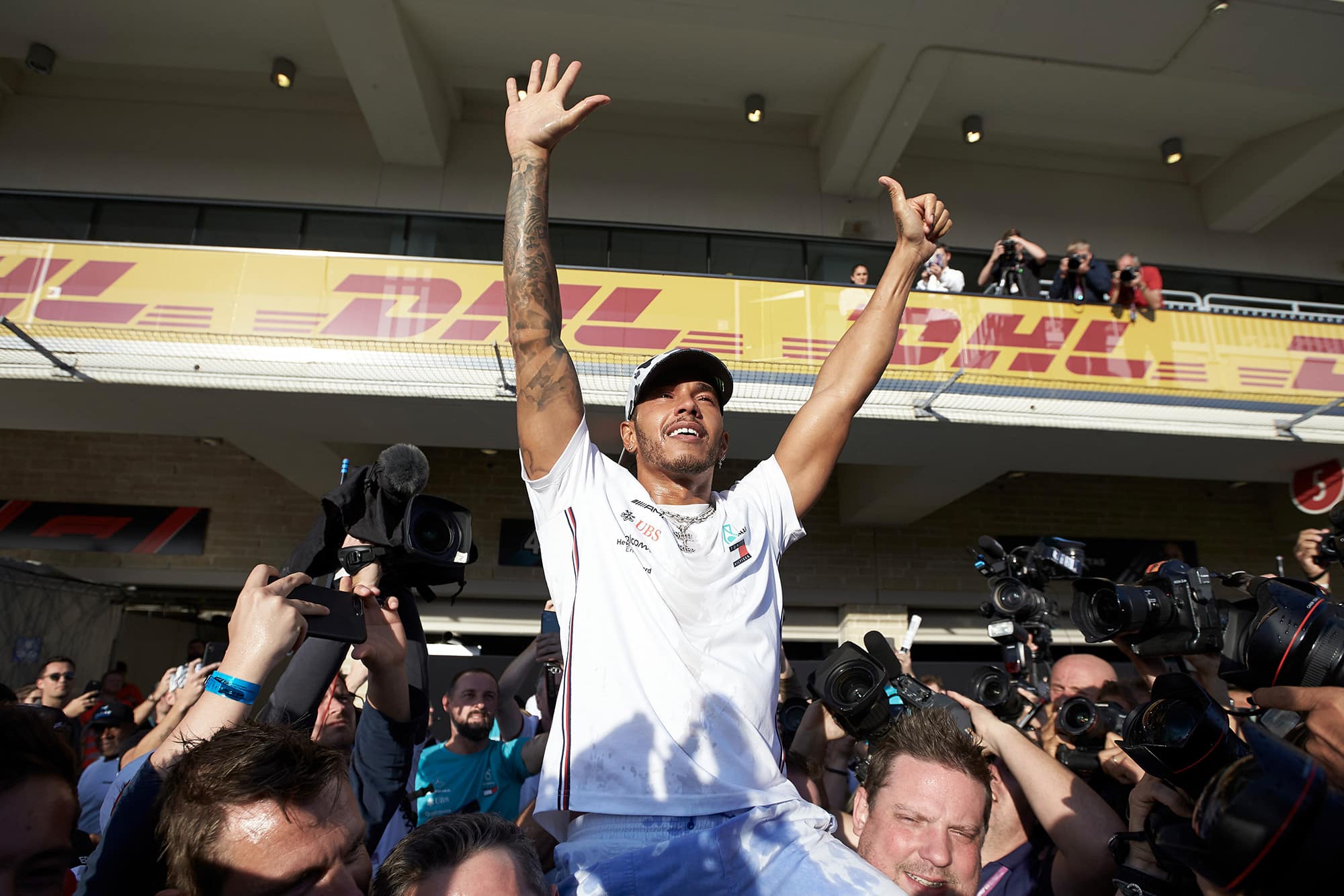 Lewis Hamilton celebrates his sixth world title