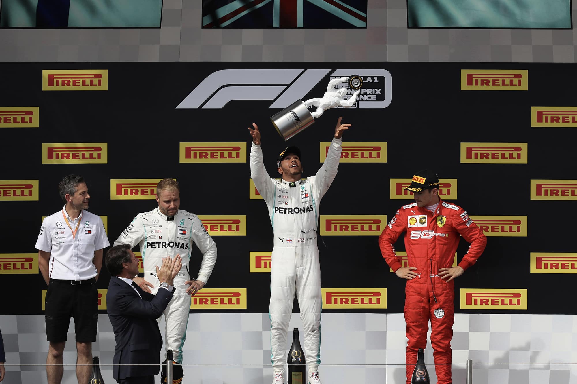 LEwis Hamilton celebrates victory on the podium after the 2019 French Grand prix
