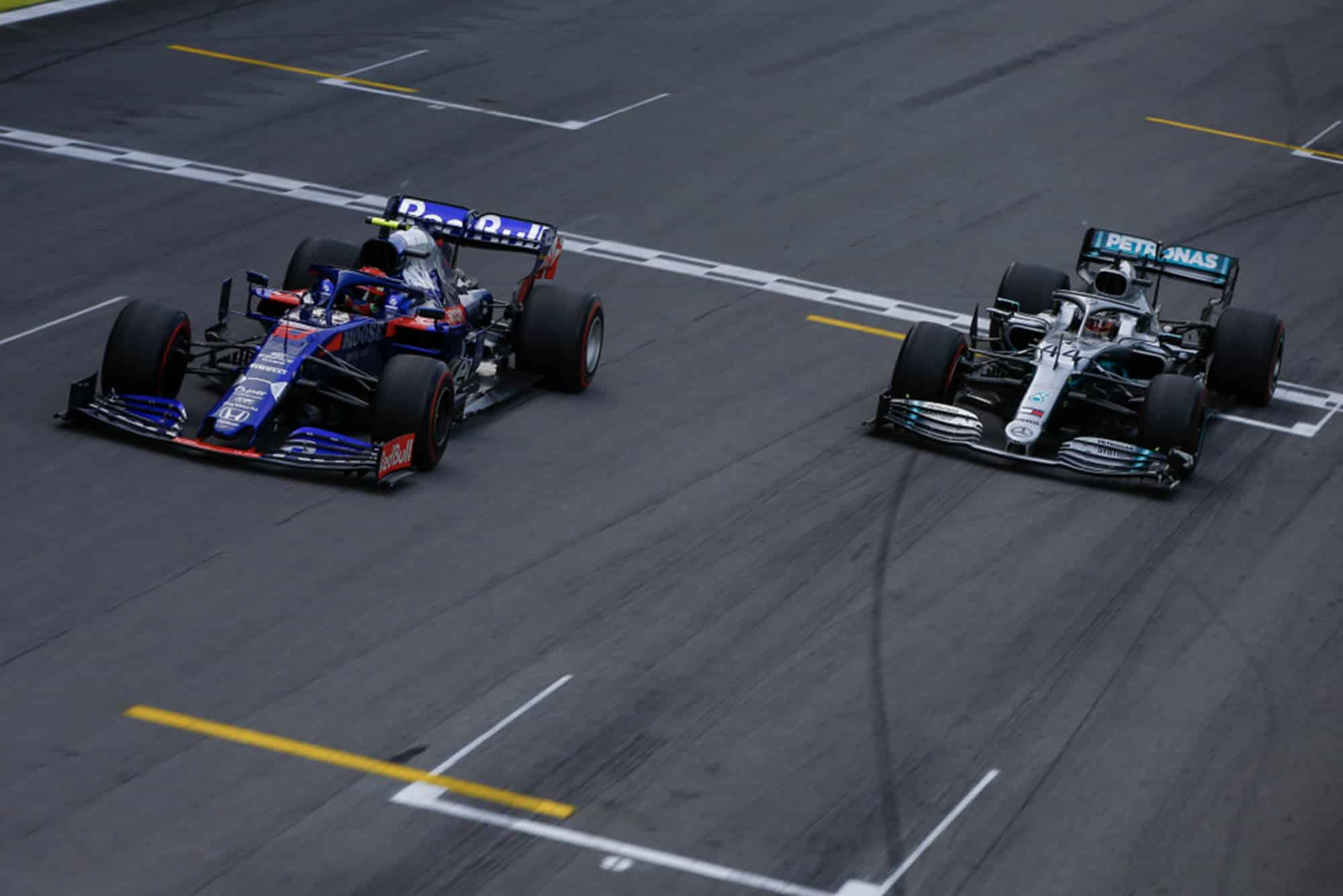 Pierre Gasly's Toro Rosso Honda out-drags Lewis Hamilton's Mercedes for second during the 2019 Brazilian Grand Prix