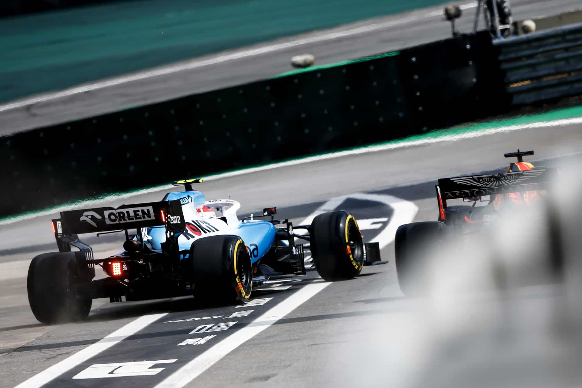 Kubica is released ahead of Verstappen in the pits during the 2019 Brazilian Grand Prix