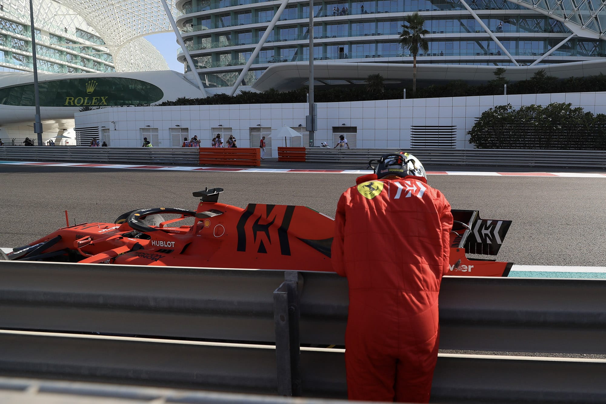 Sebastian Vettel leans against the barrier after crashing out of FP1 ahead of the 2019 Abu Dhabi Grand Prix