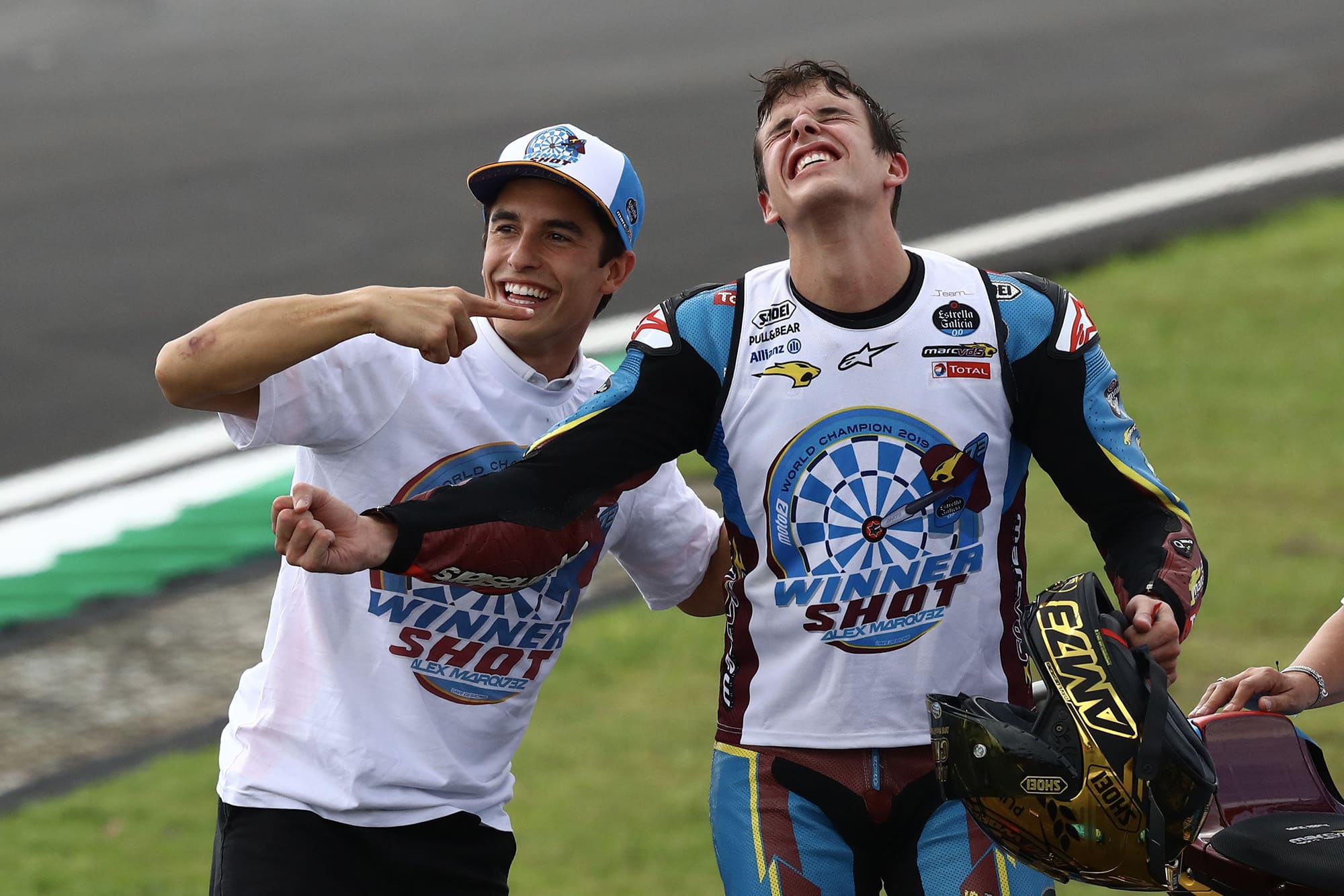 Alex Marquez celebrates winning his Moto2 title with brother Marc