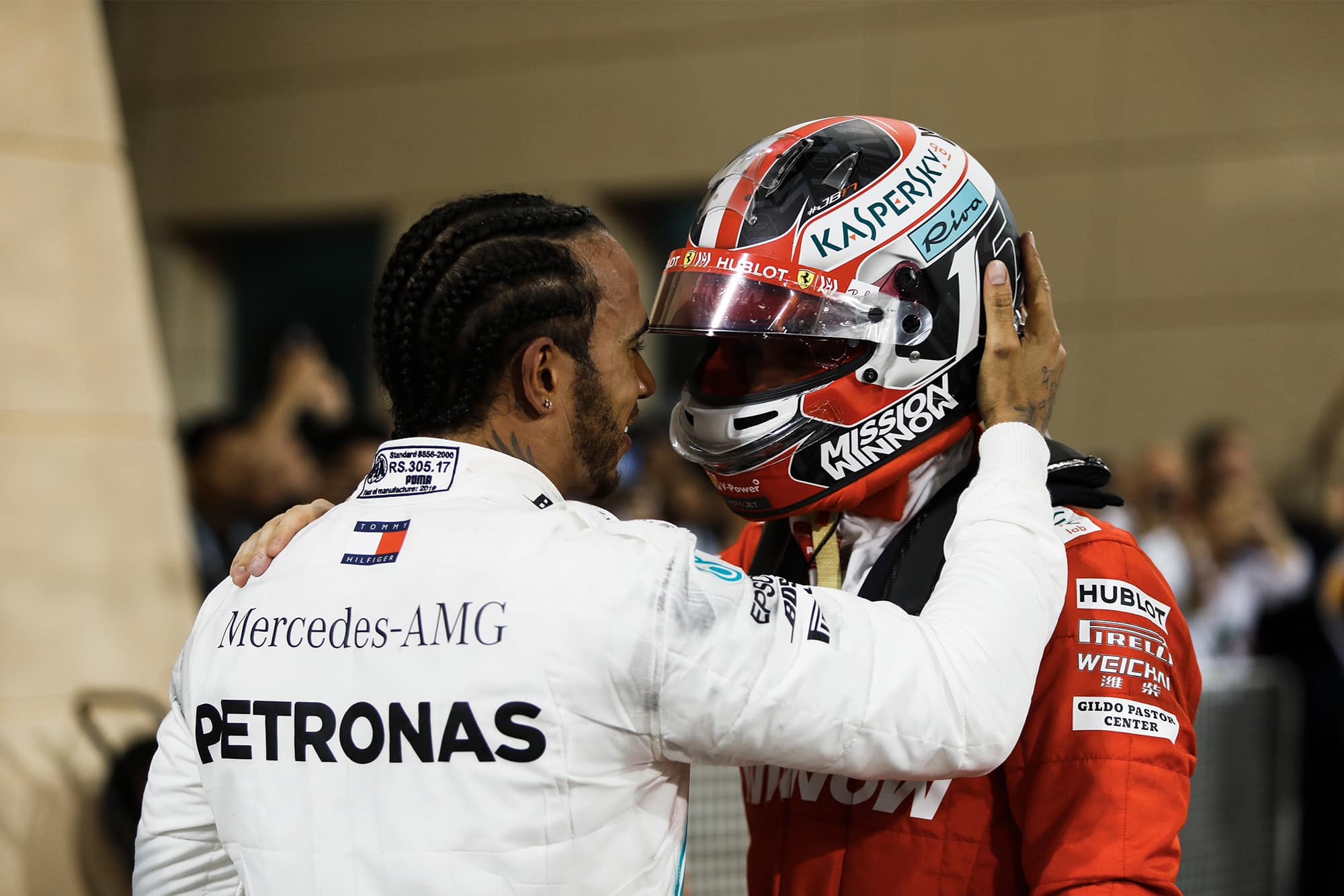 Lewis Hamilton embraces Charles Leclerc after the Bahrain Grand Prix