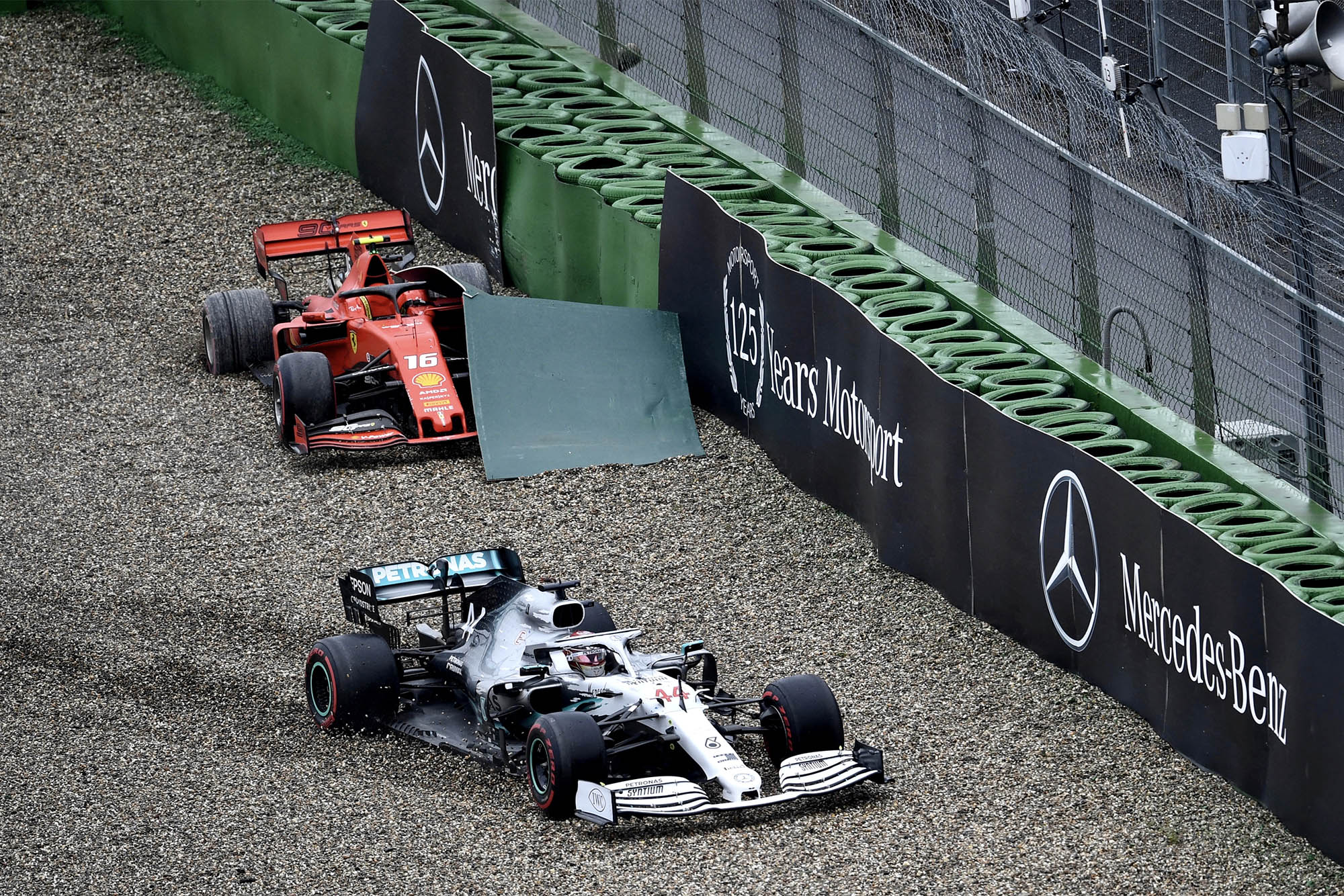 Lewis Hamilton skids past Charles Leclercs stranded Ferrari and into the barriers during the 2019 German Grand Prix