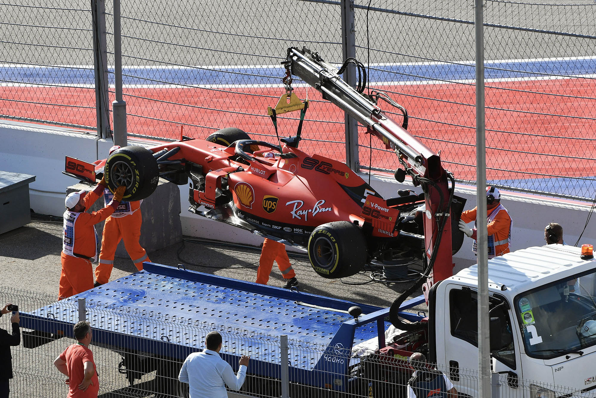 Sebastian Vettel's car is loaded onto a truck after an electrical problem forced him out of the 2019 Russian Grand Prix