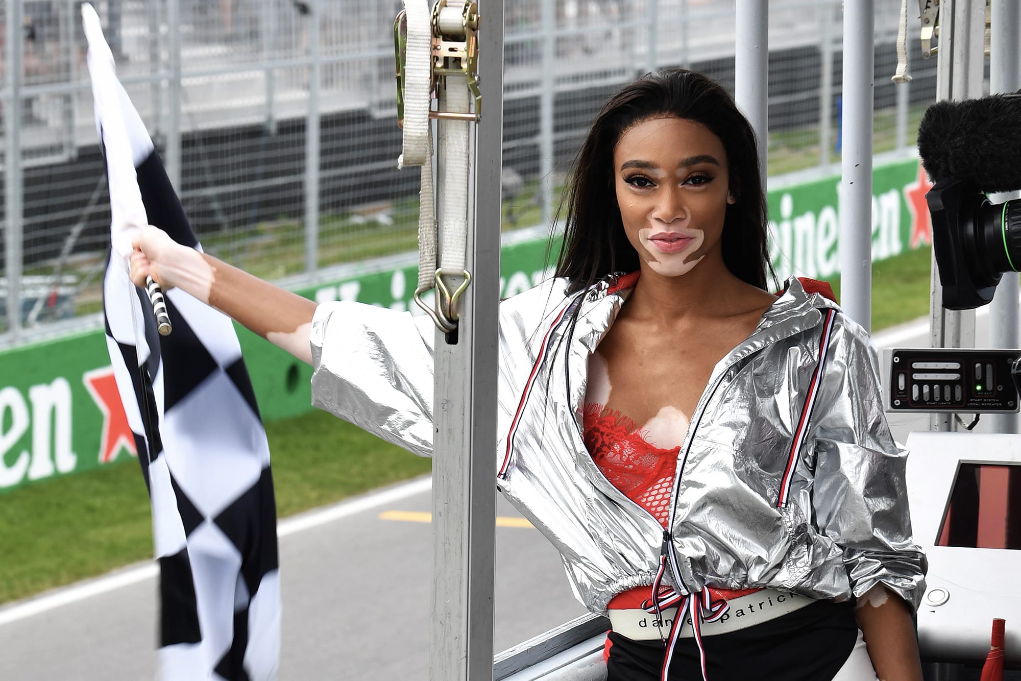 Winnie Harlow waves the chequered flag at the 2018 Canadian Grand Prix