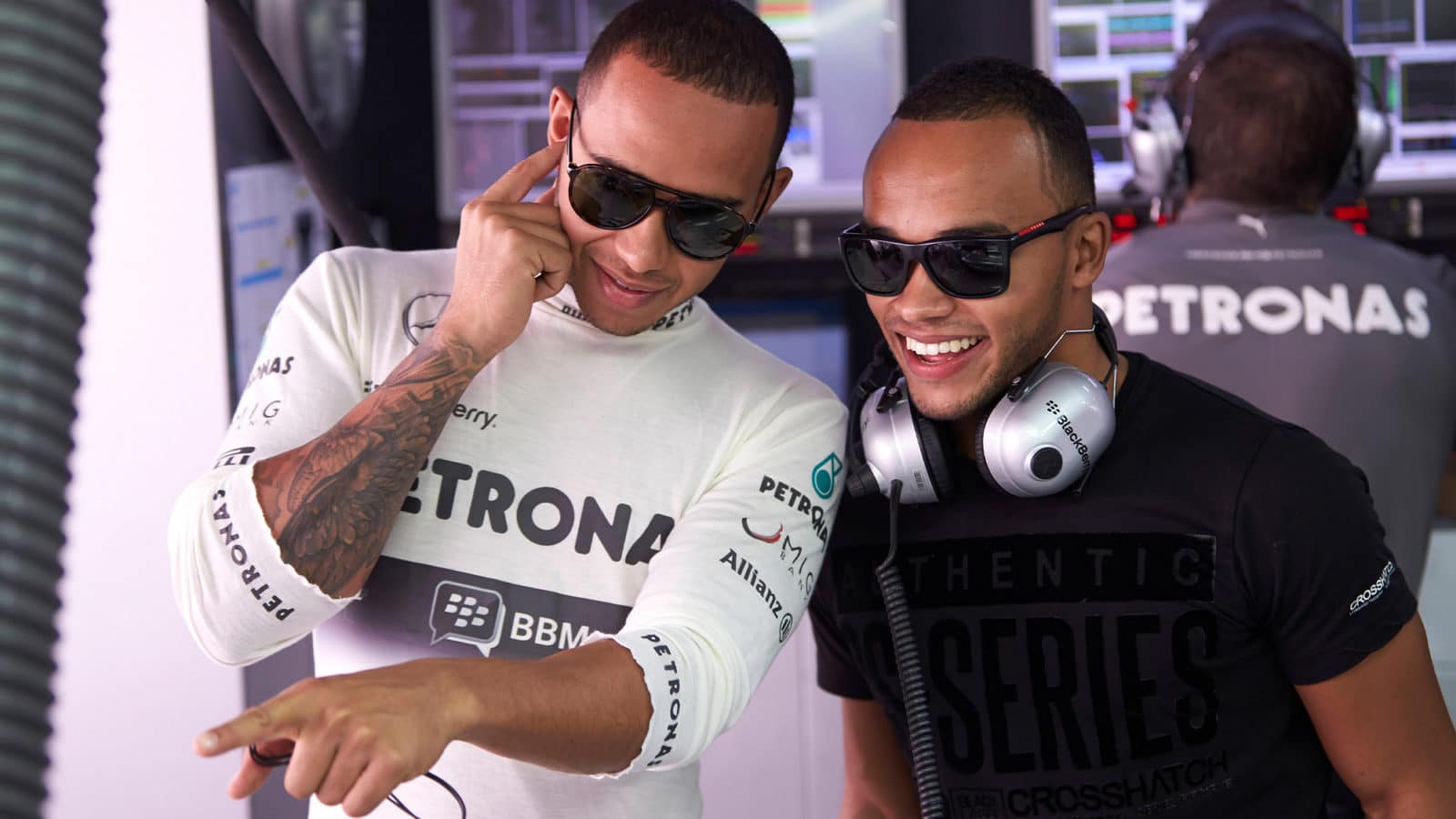 Lewis and Nicolas Hamilton in Mercedes F1 pit garage