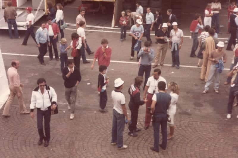A crowd around Rene Arnoux in the paddock at the 1981 Italian Grand Prix
