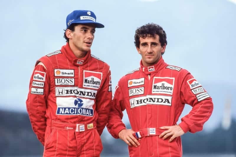 Ayrton Senna stands next to Alain Prost at the 1989 McLaren team photoshoot GPP