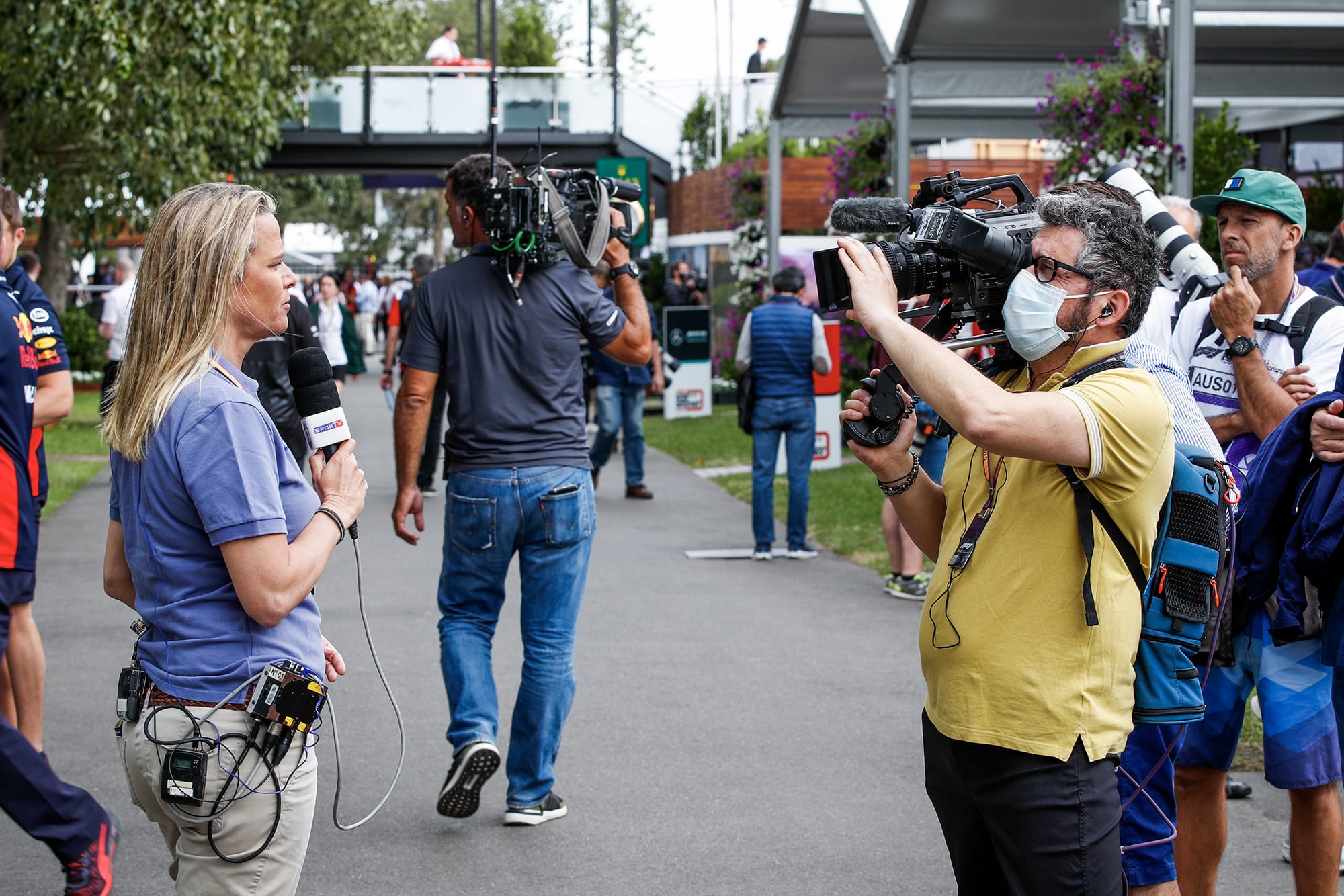 Cameraman in a face mask in the paddock at the 2020 Australian Grand Prix