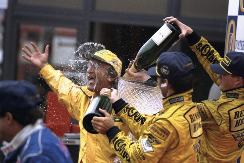 Eddie Jordan celebrates victory at the 1998 Belgian Grand Prix