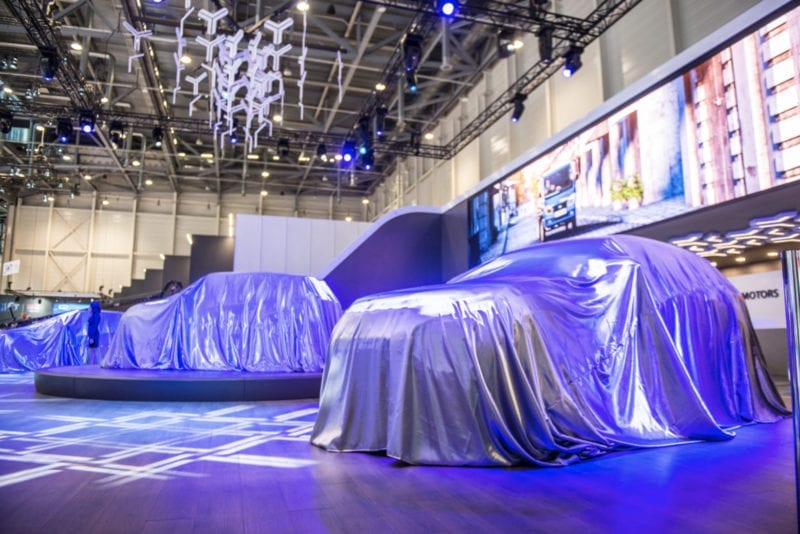 Covered cars waiting to be revealed at the 2019 Geneva Motor Show