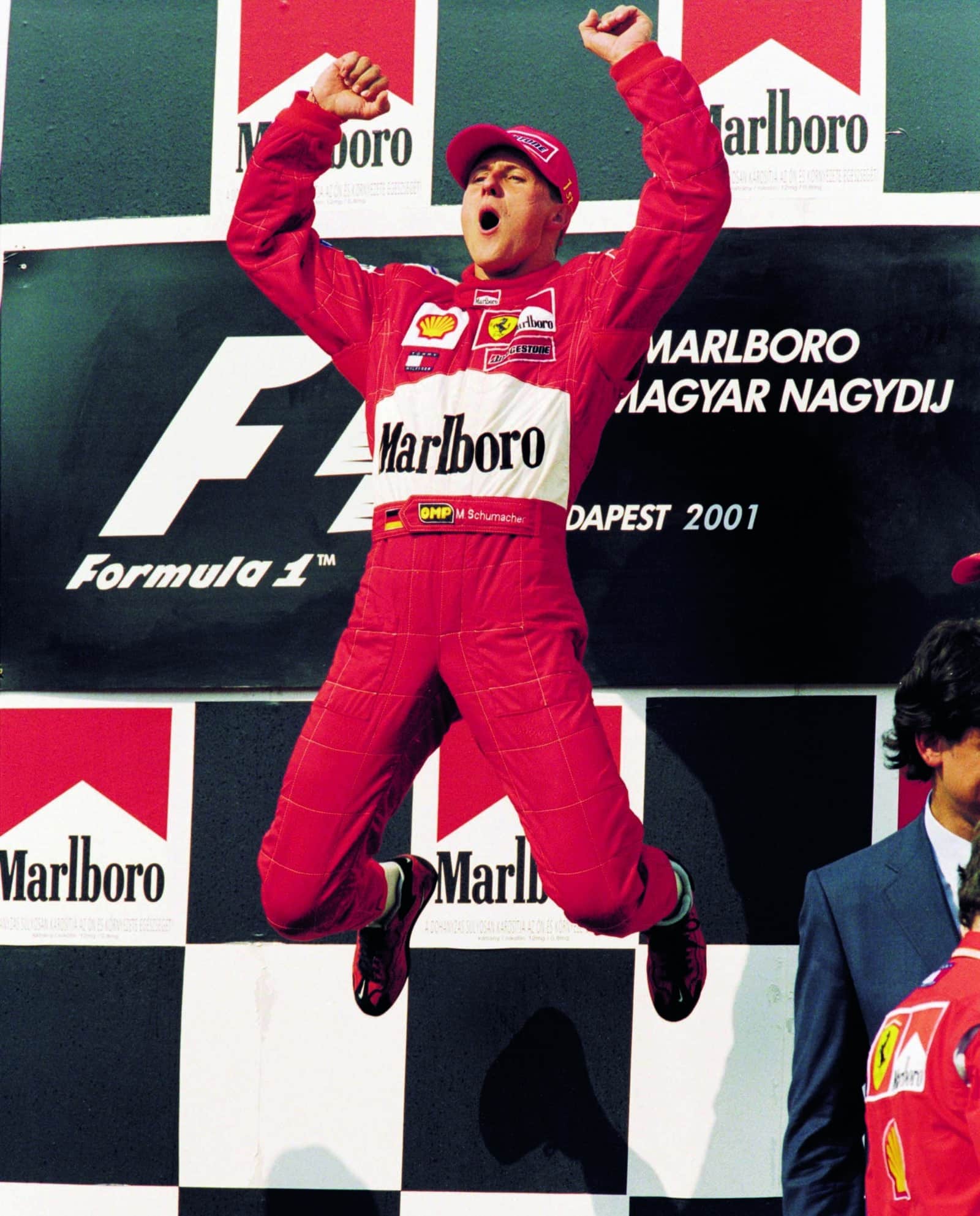 Schumcher-leaps-on-the-podium-after-winning-the-2001-Hungarian-Grand-Prix