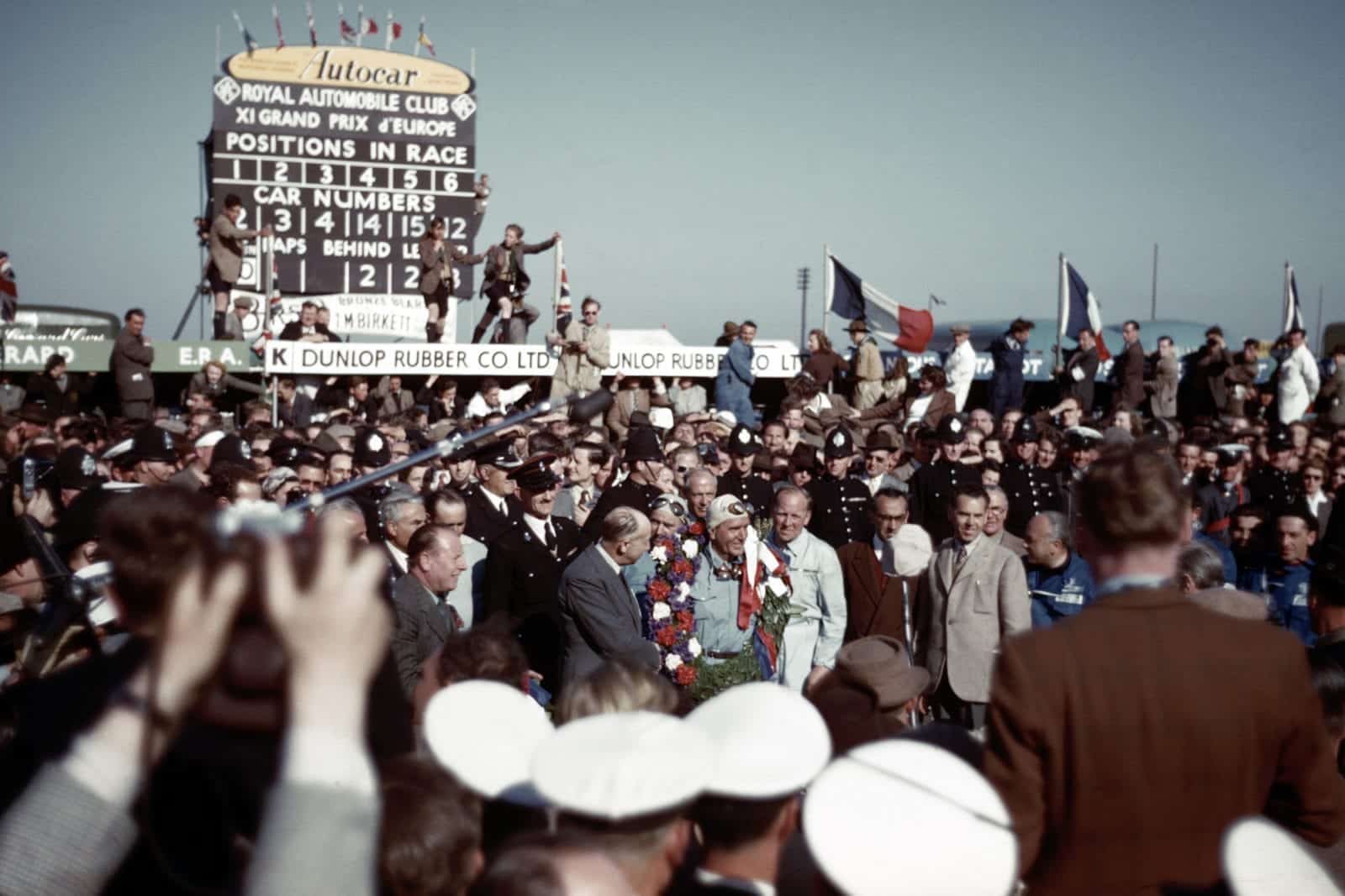 Crowds around Giuseppe Farina after the 1950 British Grand Prix