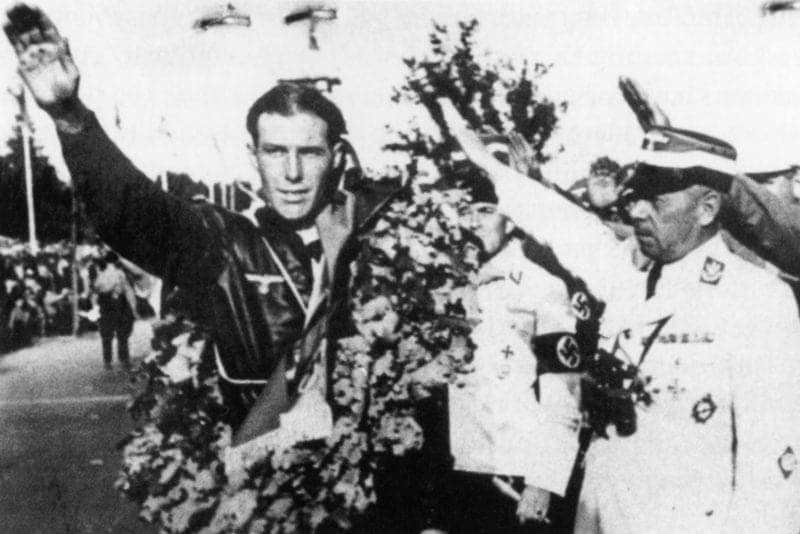 Georg Meier salutes alongside Adolf Huhnlein