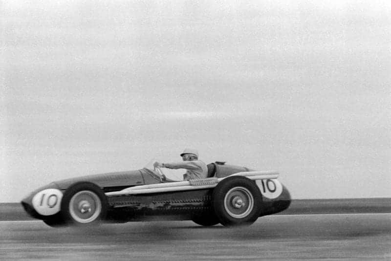 Stirling Moss at speed in a Maserati 250F in the Glover Trophy at Goodwood