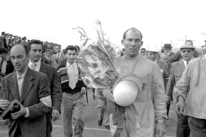Stirling Moss after winning the 1958 Portuguese Grand Prix