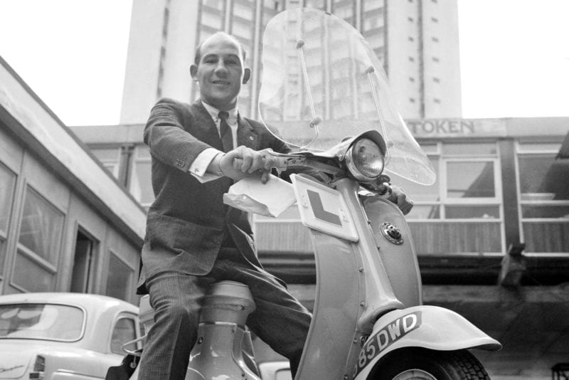 Stirling Moss in London on a scooter