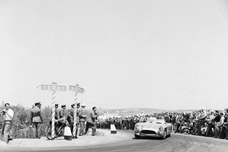 Stirling Moss rounds a corner in the 1955 Mile Miglia