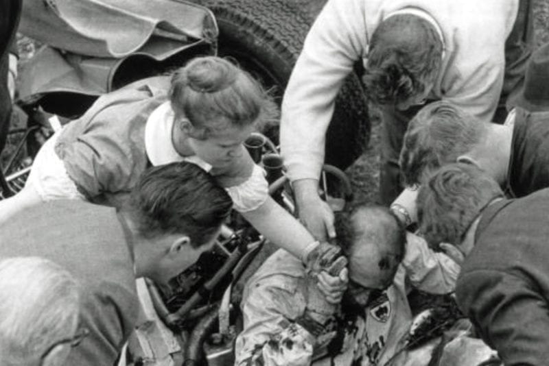 Stirling Moss is pulled from the wreckage of his car at Goodwood in 1962