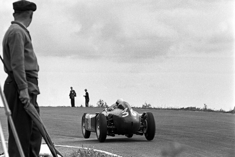 Eugenio Castellotti in a Lancia D50 on three wheels at Raidillon at Spa Francorchamps