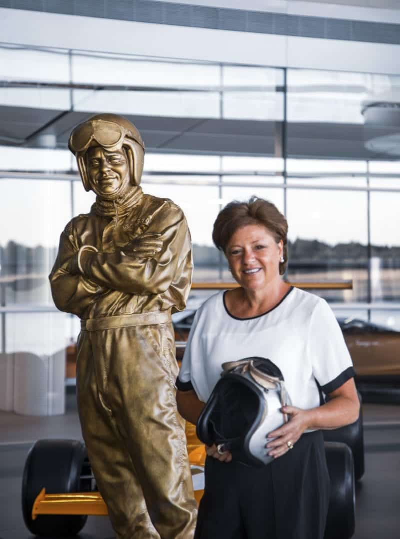 Amanda McLaren with statue of Bruce McLaren