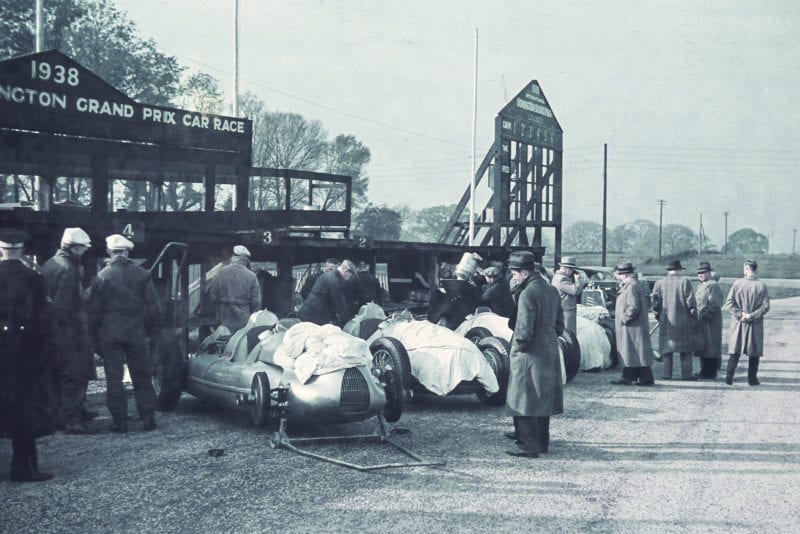 Auto Union cars lined up in the pitlane at Donington Park ahead of the 1938 Grand Prix