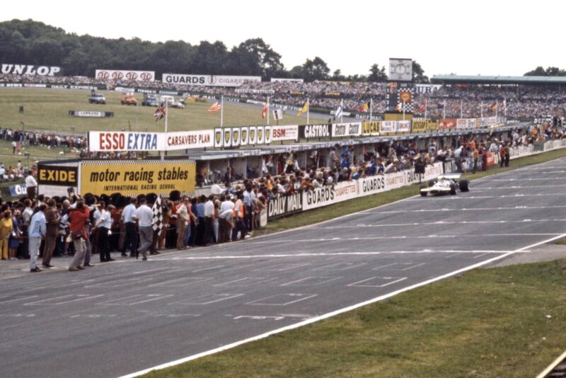 Jack Brabham crosses the line to take secind place at BRands Hatch in the 1970 F1 British Grand Prix