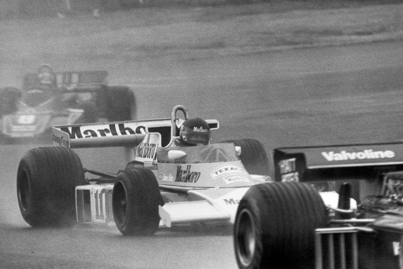 James Hunt battles through the traffic in the 1976 Japanese Grand Prix