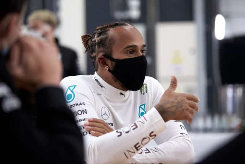 Lewis Hamilton puts his thumb up while wearing a mask at a 2020 Silverstone test