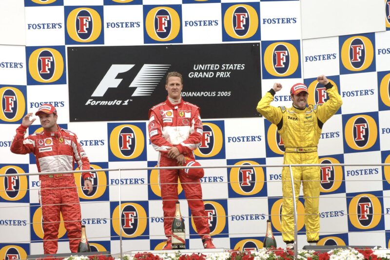 Tiago Monteiro alongside Michael Schumacher and Rubens Barrichello on the podium at the 2005 US Grand Prix