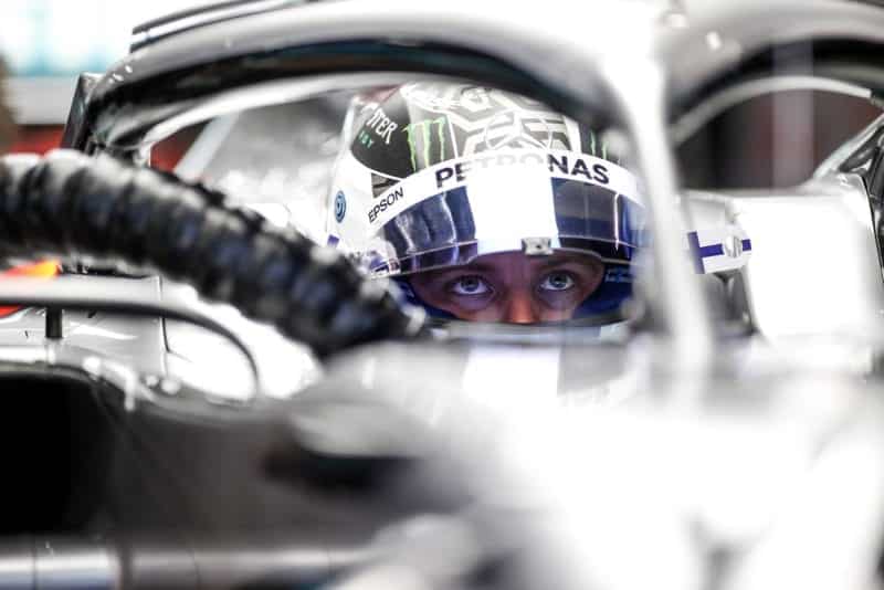 Valtteri Bottas sits in his Mercedes in the pits
