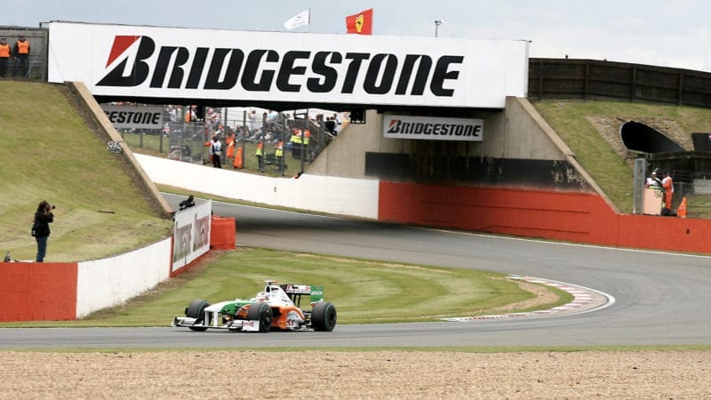 Adrian Sutil's Force India drives away from Bridge Corner at Silverstone in 2009