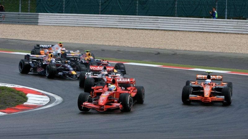 Felipe Massa overtakes Markus Winkelhock for the lead of the 2007 European F1 Grand Prix at the Nurburgring after the restart
