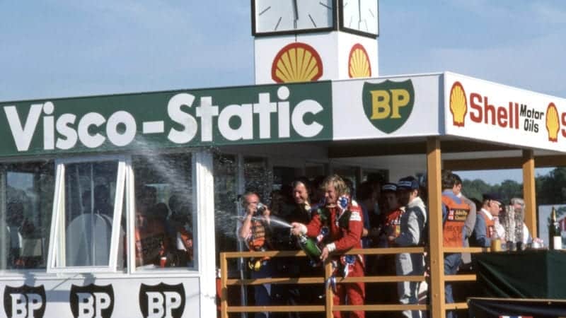 James Hunt sprays champagne on the podium after winning the 1976 British Grand Prix at Brands Hatch - provisionally