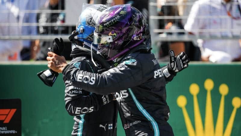 Lewis Hamilton and Valtteri Bottas in a celebratory hug after qualifying 1-2 for the 2020 F1 Austrian Grand Prix