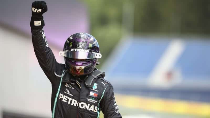 Lewis Hamilton raises his hand in the air after winning the 2020 F1 Styrian Grand Prix at the Red Bull Ring