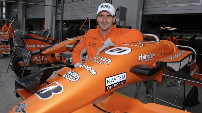 Markus Winkelhock next to a Spyker nosecone ahead of his only F1 drive at the 2007 European F1 Grand Prix at the Nurburgring