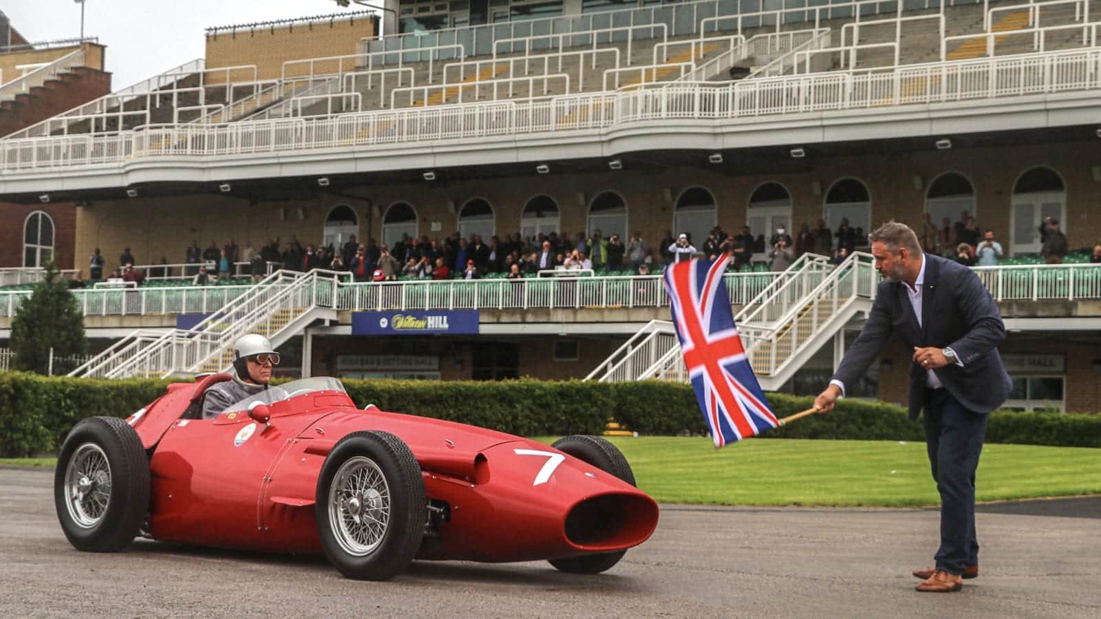 Rick Hall sets off at Aintree in Stirling Moss's Maserati 250F to commemorate his 1955 British GP win