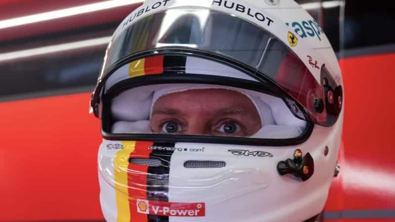 Sebastian Vettel looks out from his helmet