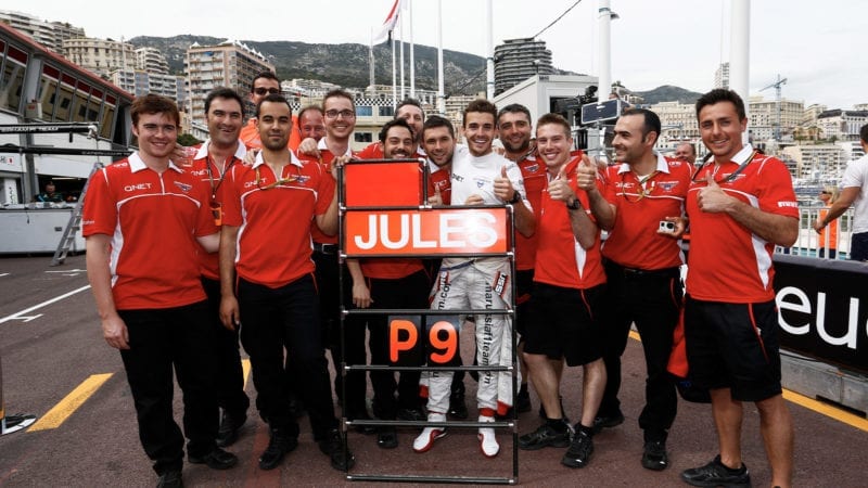 The Marussia team celebrates Jules Bianchi's ninth place at the 2014 Monaco Grand Prix