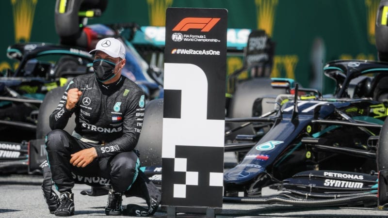 Valtteri Bottas in front of his Mercedes W11 after qualifying first for the 2020 Austrian Grand Prix