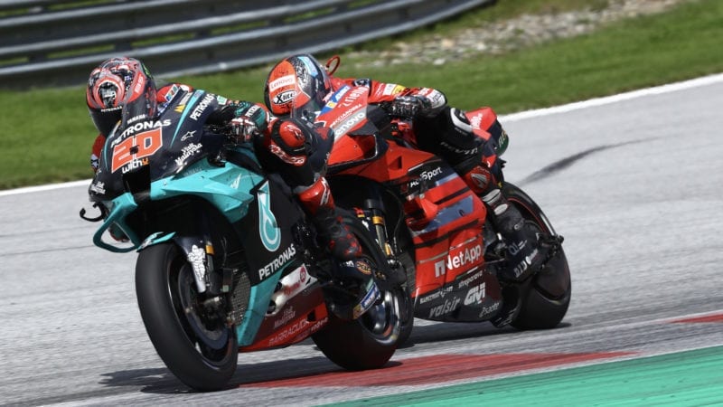Fabio Quartararo is chased by Danilo Petrucci in the 2020 MotoGP Austrian Grand prix