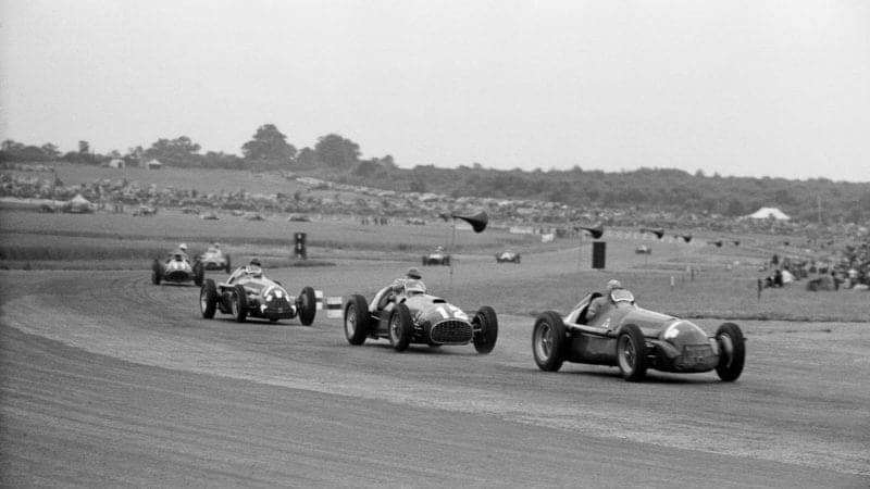 Felice Bonetto leads Jose Froilan Gonzalez Giuseppe Farina Alberto Ascari and Juan Manuel Fangio at the start of the 1951 British Grand Prix at Silverstone