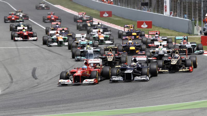 Fernando Alonso gets ahead of Pastor Maldonado at the start of the 2012 Spanish Grand Prix