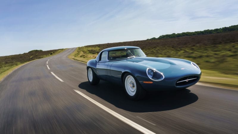 Front three quarters shot of the 2020 Eagle E-type Lightweight GT driving on a country road