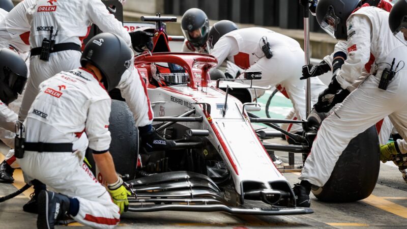 Kimi Raikkonen in the Silverstone pits during the 2020 F1 British Grand Prix with a broken front wing