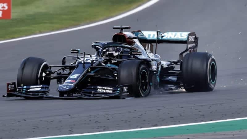 Lewis Hamilton heads to victory in his Mercedes W11 despite a punctured tyre in the 2020 F1 British Grand Prix at Silverstone